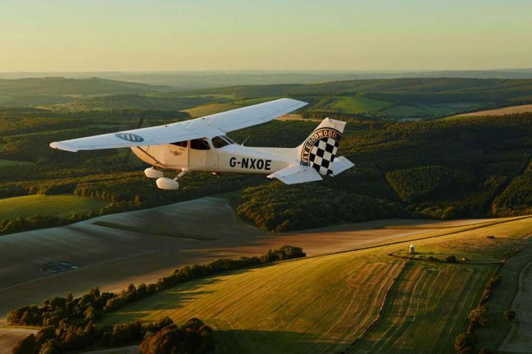 Photo of a plane flying over Goodwood Hotel 