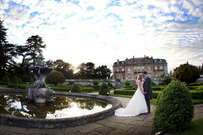 Photo of a wedding by the Luton Hoo pond